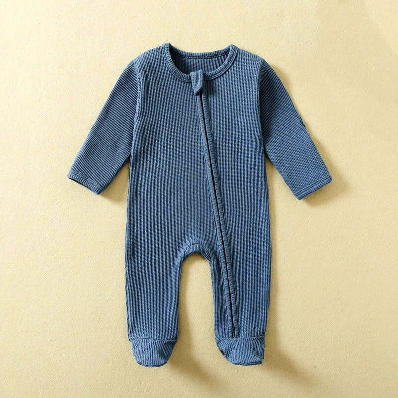 Blue 100% organic cotton baby romper with long sleeves and zipper closure, perfect for 0-12 months. Eco-friendly footed PJ's for newborns.