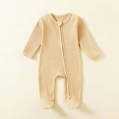 100% organic cotton baby romper in pastel color, featuring a soft, breathable waffle fabric and zipper closure, perfect for newborns (0-12M)