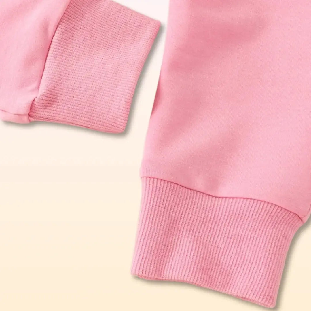 Close-up of pink sleeves from a Daddy's Girl Sweatshirt and Trouser Duo, perfect for toddlers (0-3T) with cute ribbed cuffs.