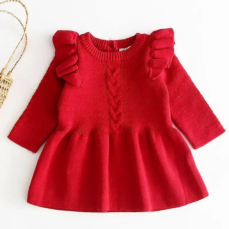 Cranberry red knit dress with ruffle shoulders and flare design, perfect for stylish and cozy autumn outings.