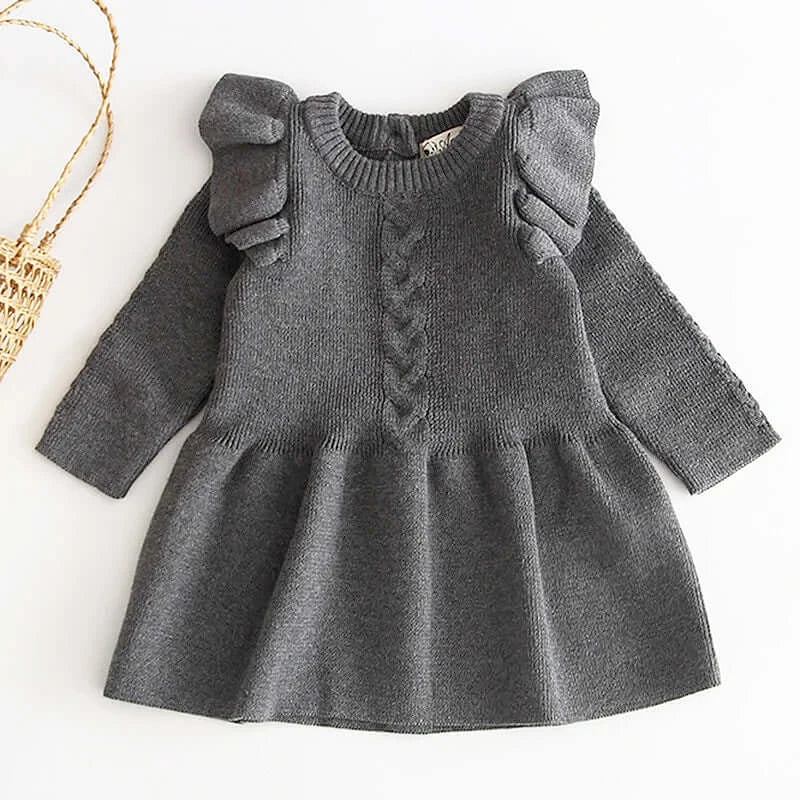 Grey knit dress with ruffle shoulders and flare design for toddlers, perfect for cozy autumn outings or family gatherings.