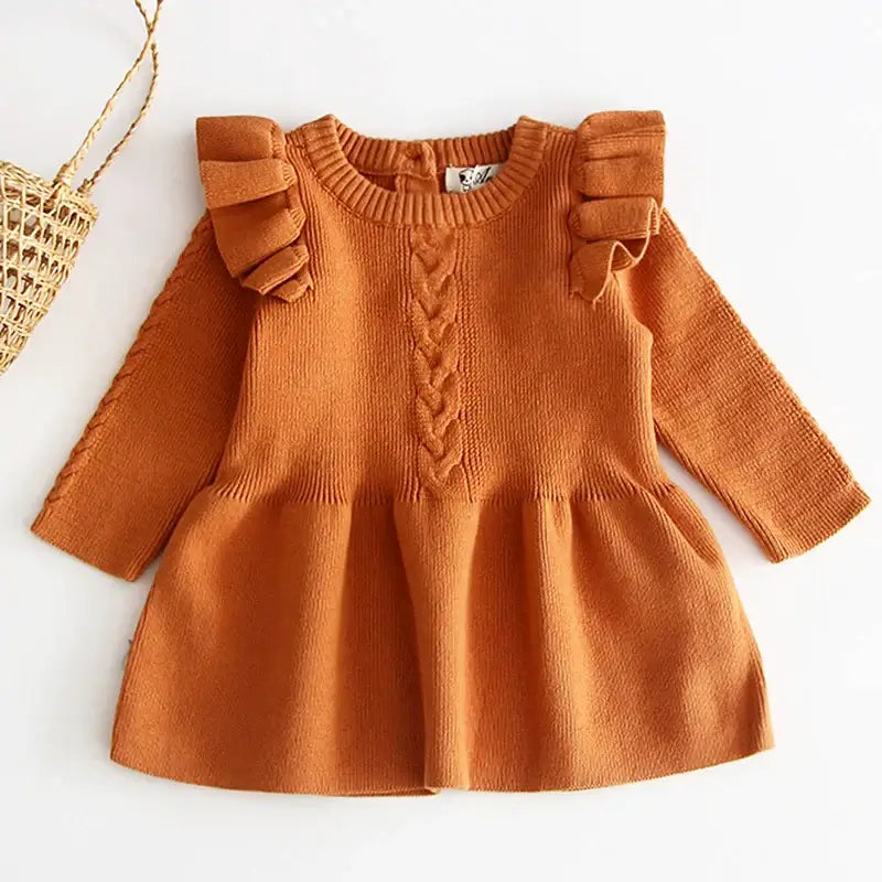 Pumpkin spice knit dress with ruffle shoulders, perfect for fall outings and cozy vibes.