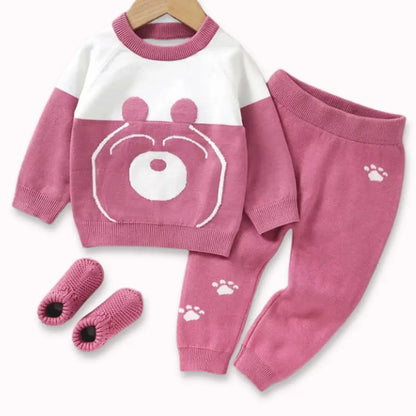 Berry Bear Cozy Knit Set for toddlers with sweater, pants featuring paw prints, and cute socks in pink and white design.