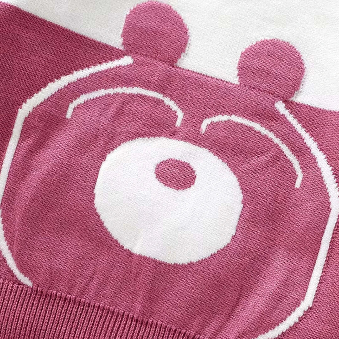 Close-up of berry bear knit sweater pattern from the Berry Bear Cozy Knit Set for toddlers, featuring an adorable bear face design.