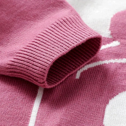 Close-up of a pink knit sweater sleeve from the Berry Bear Cozy Knit Set for toddlers, featuring soft, breathable fabric.