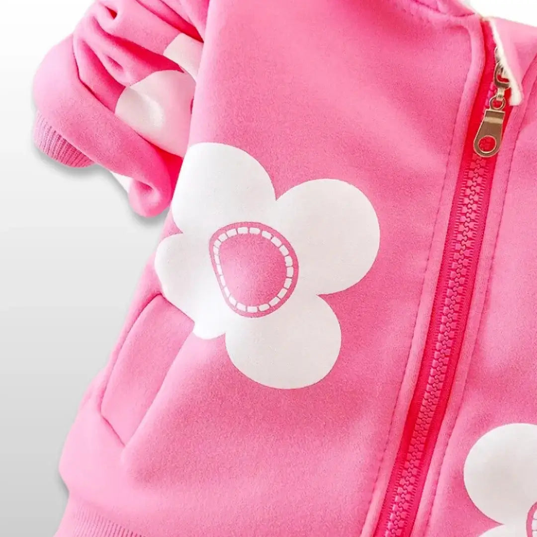 Pink floral hoodie with playful white flower appliqué, perfect for cozy and stylish toddlers.