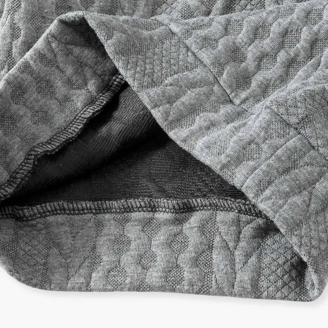 Close-up of knitted cotton fabric in dark grey with a textured, quilted pattern, part of the Boys' Casual Fashion Set.