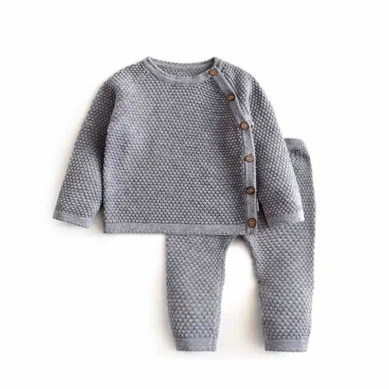 Baby's two-piece knit set in gray from Luxe Comfort Knit Collection, featuring a cozy top with buttons and matching pants.