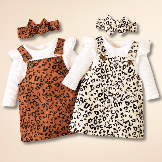 Chic leopard baby overall dress set with long sleeve onesie and matching bow.