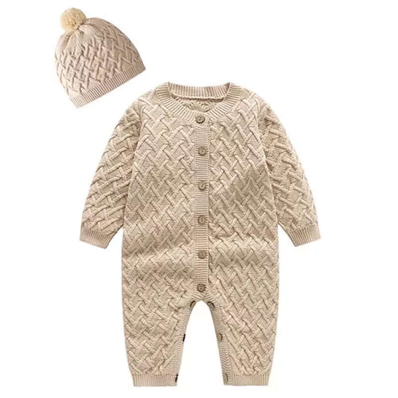 Cozy cable-knit romper set with wood buttons and pom-pom beanie in warm apricot for babies 0-24M, perfect for chic comfort.