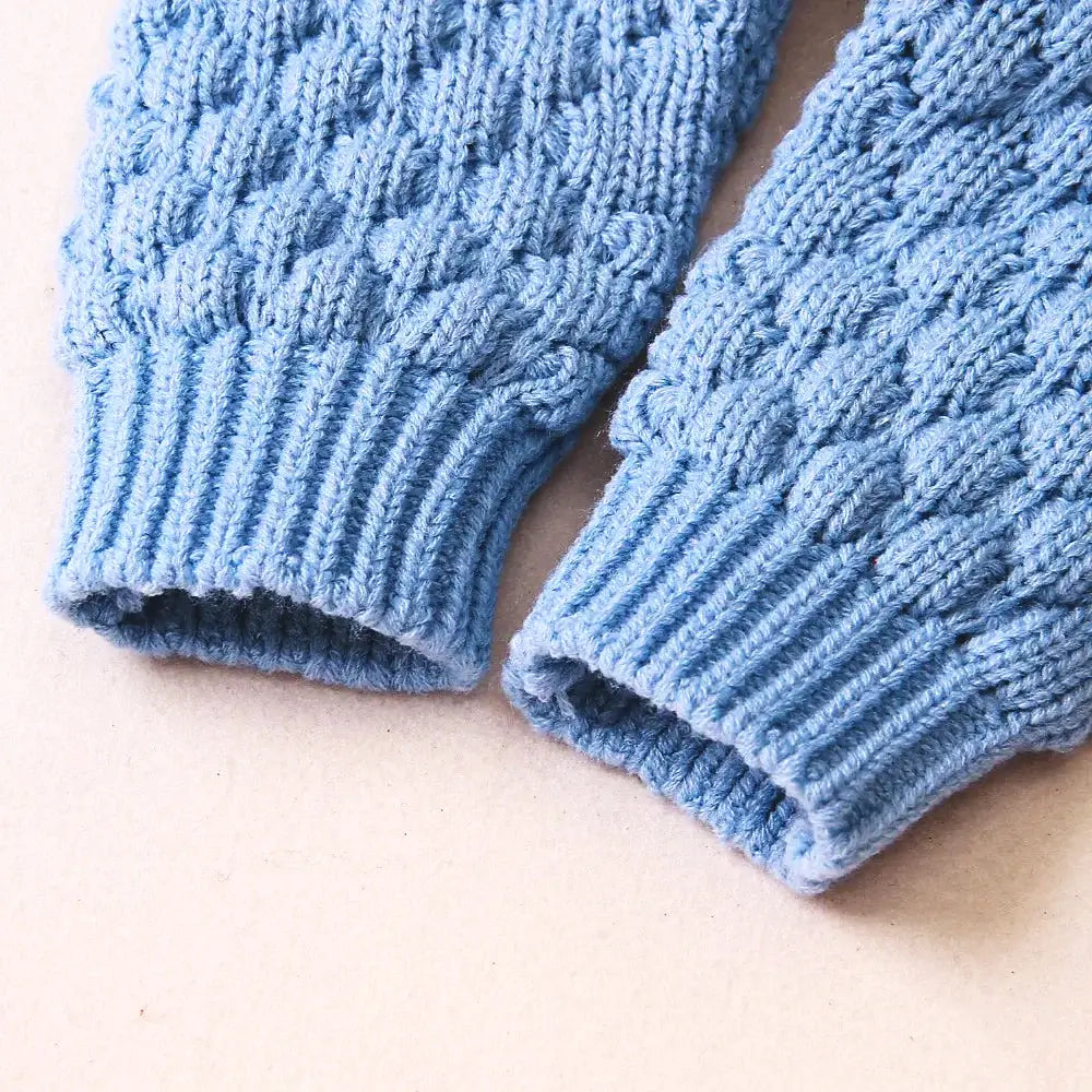 Close-up of blue knit sleeves from Cuddle Bear Knit Romper showing soft, thick texture for baby warmth and comfort.