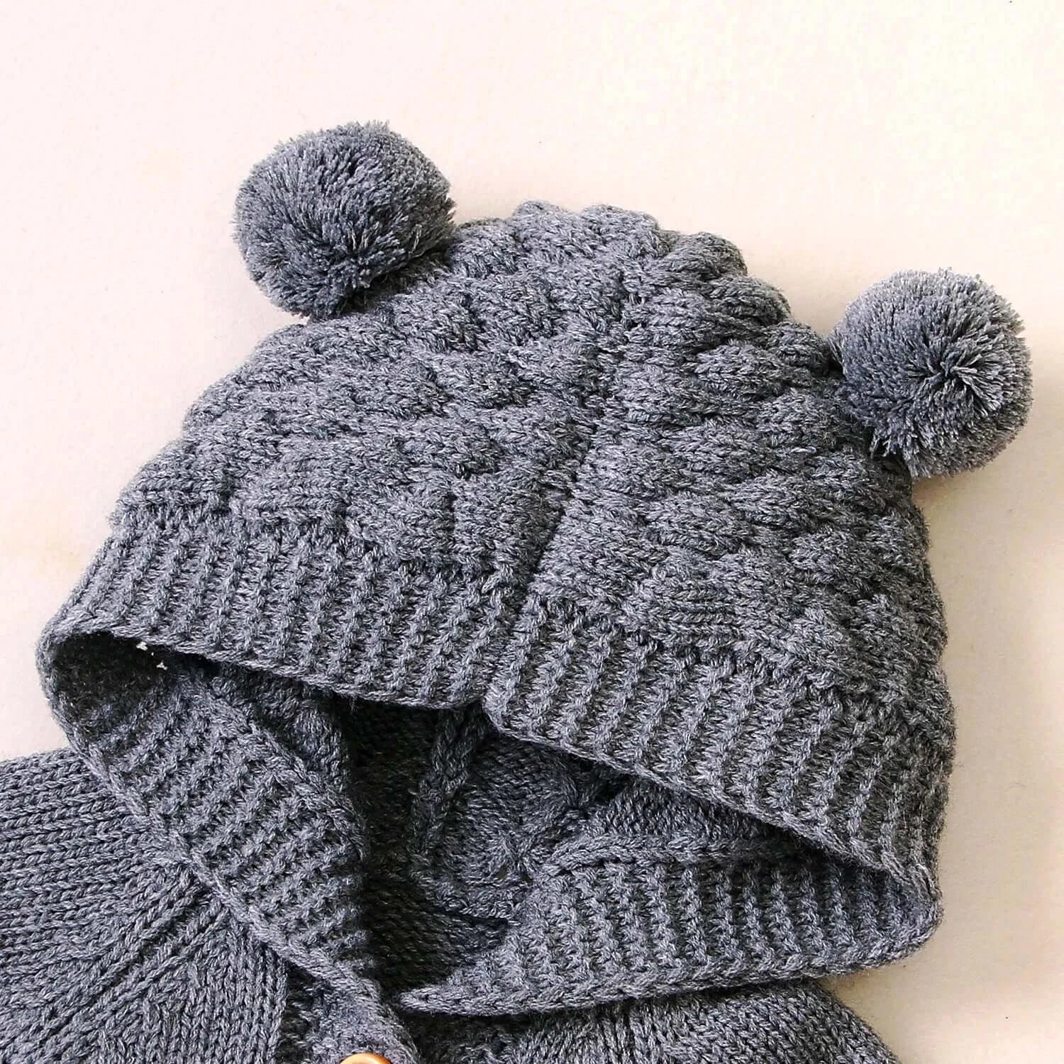 Grey knit hooded romper with bear ears for babies, cozy and warm, perfect for 0-18 months.