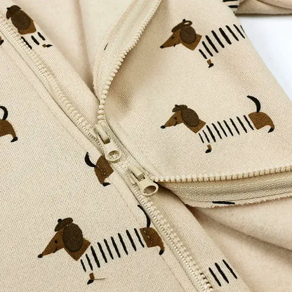 Close-up of a cozy dachshund patterned romper with a zipper, perfect for little ones aged 3-24M.