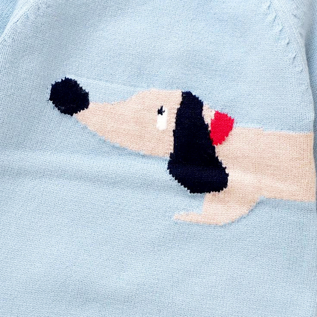 Close-up of an adorable dachshund design on a light blue knit fabric, part of the Dapper Dachshund Knit Romper for babies.