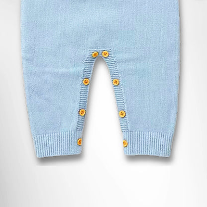 Cozy blue knit romper with yellow buttons, perfect for keeping babies warm in winter.