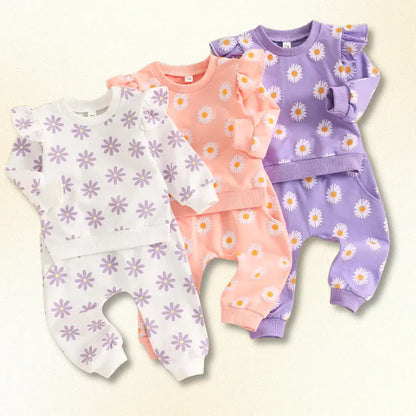 Colorful Flower Power sweatshirts and joggers set for babies, featuring playful floral prints in three vibrant colors.