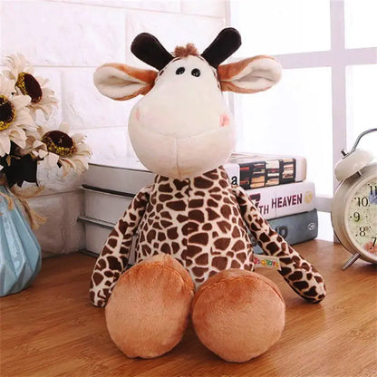 Jungle Friends plush giraffe doll on a shelf, perfect for playtime and snuggles. Soft and huggable, designed for imagination and adventure.