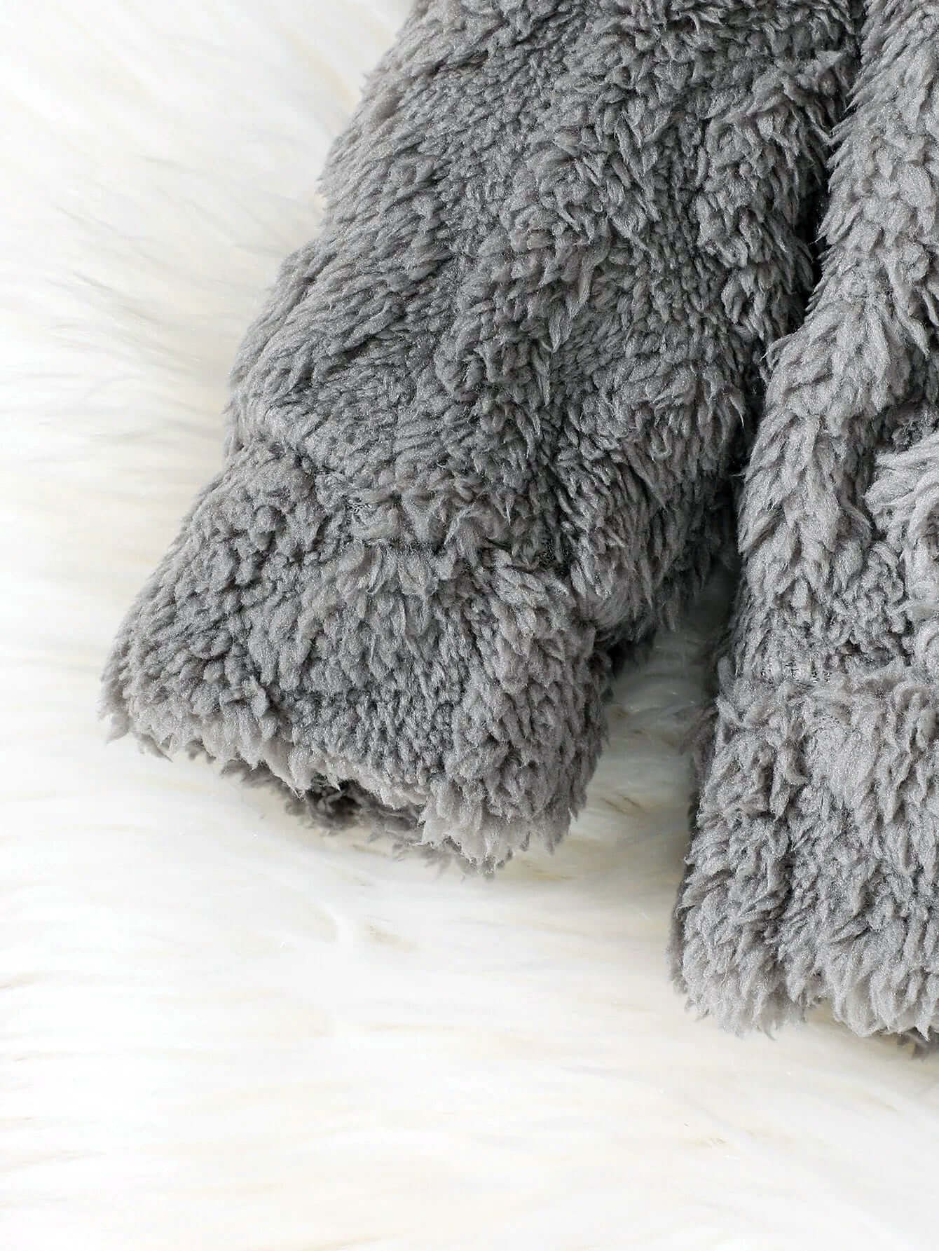 Close-up of fuzzy gray fabric from Cloud-Soft Knit Hoodie, showcasing the soft texture perfect for baby and toddler coziness.