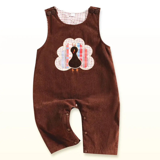 Gobble & Groove Corduroy Baby Overalls with Turkey Appliqué, perfect for Thanksgiving, featuring soft fabric and snap closures.