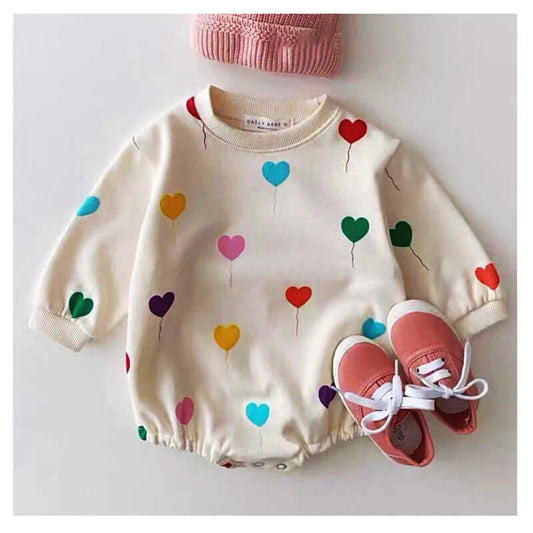 Baby romper with colorful heart balloon print, long sleeves, and cozy fabric.