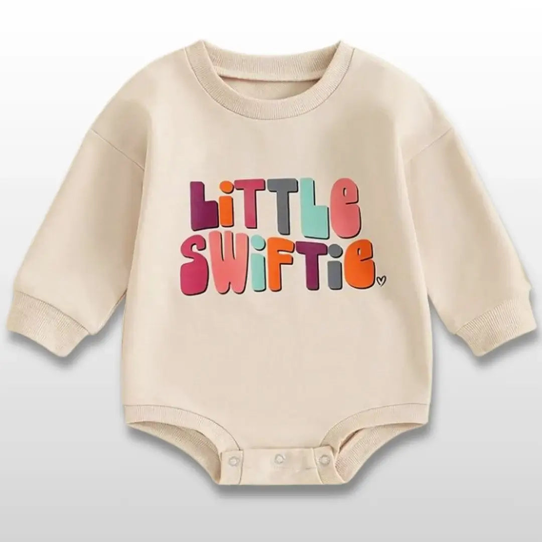 Baby romper with "Little Swiftie" text, long-sleeve crew neck, perfect for Swiftie fans, size 0-18M. Cozy and stylish fall outfit.