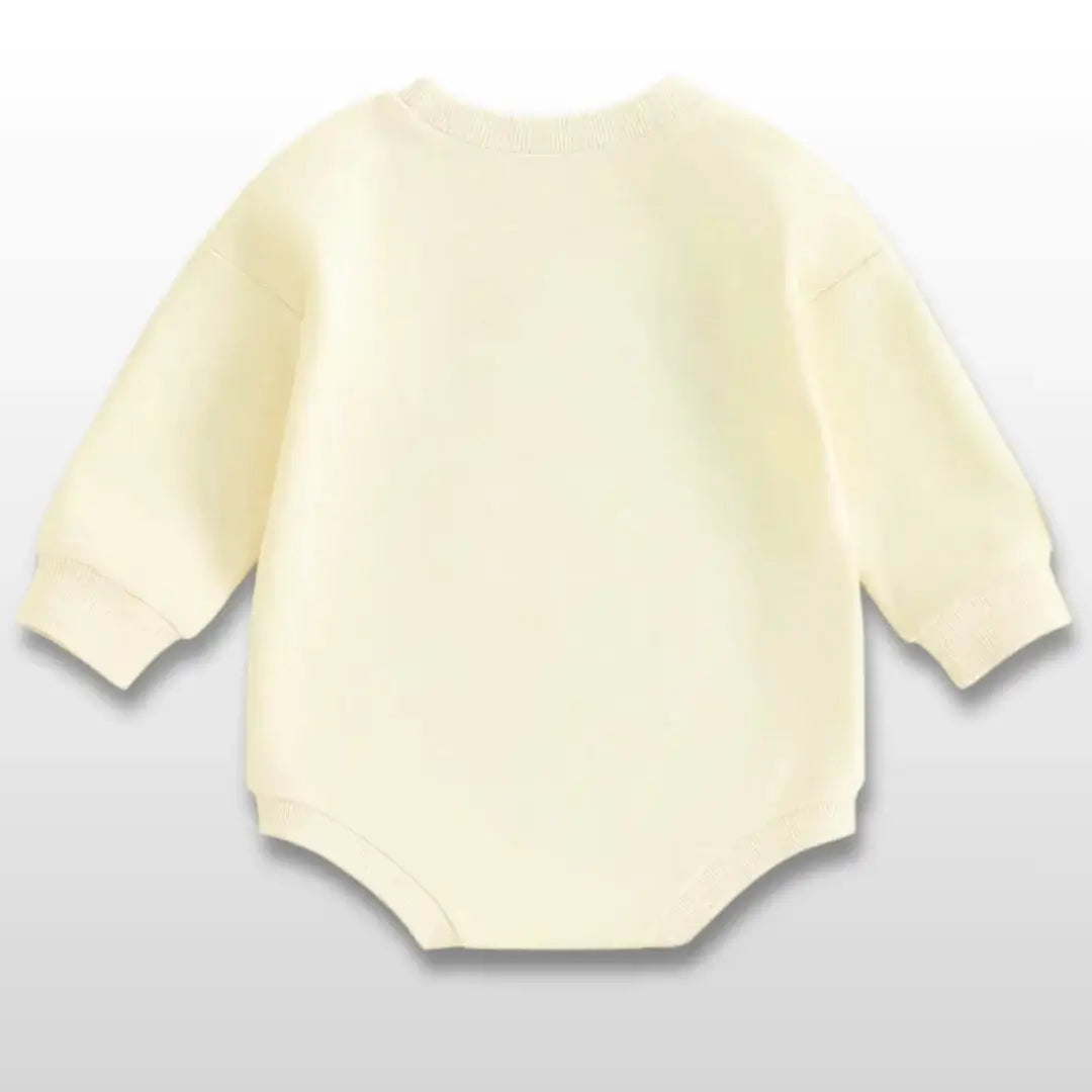 Cozy long-sleeve cream baby romper for Swiftie fans, perfect for fall outings and home snuggles.