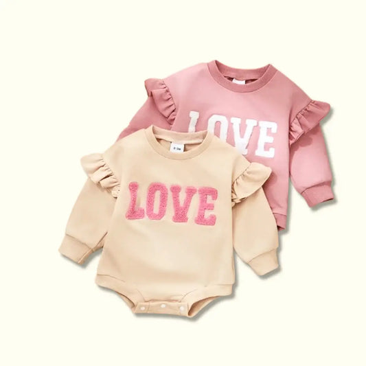 Pink and beige ruffle baby rompers with "LOVE" embroidery in cozy cotton, perfect for infants 3-18 months.