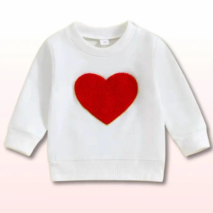 White sweatshirt for toddlers with a red heart applique, perfect for cozy love and style, ideal for chilly days.