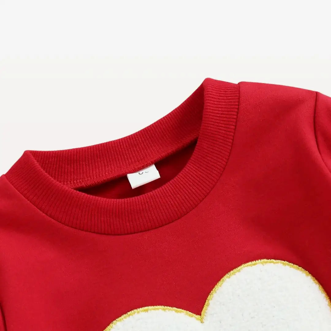 Red Love & Snuggles Heart-Embroidered Sweatshirt for toddlers, detailed with a golden-edged heart applique, perfect for cozy style.