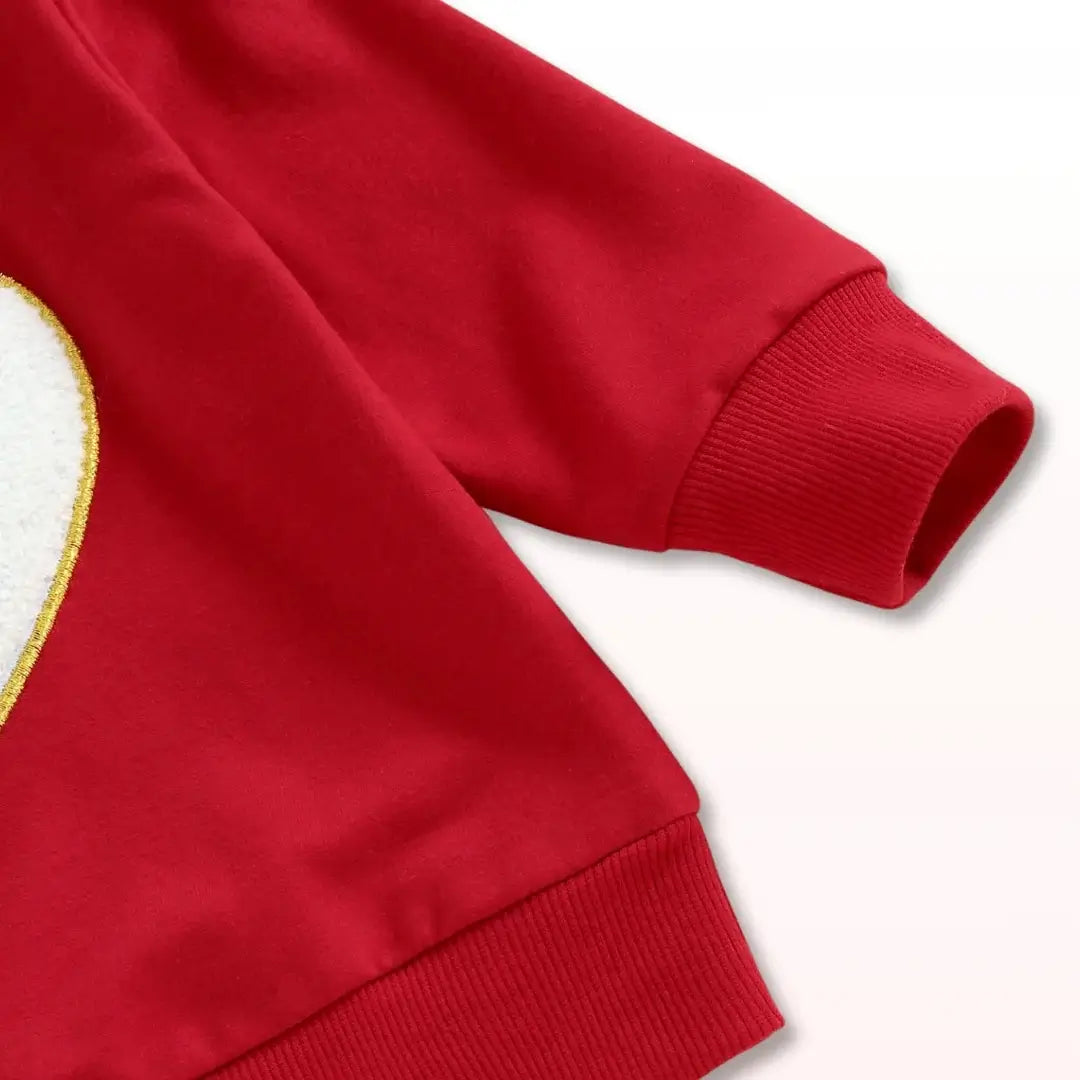 Cozy red sweatshirt with heart applique, perfect for toddlers aged 6 months to 3 years, adding warmth and style to any outfit.