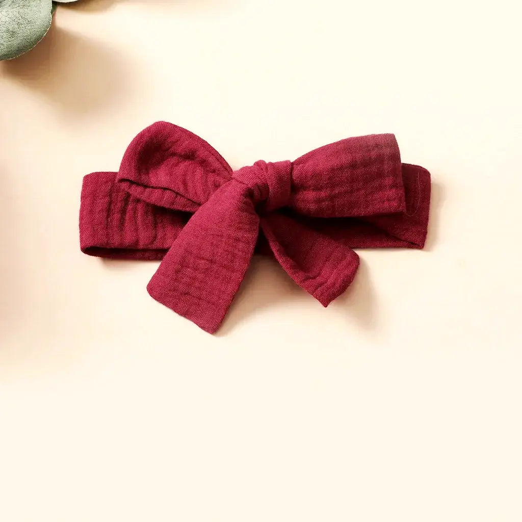 Burgundy baby headband with bow adds charm to any infant outfit. Perfect accessory for Little Princess Butterfly Dress!