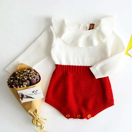 Parisian Chic Ruffle Knit Romper for baby girls with a bouquet of flowers, red and white cozy romper with buttons and long sleeves.