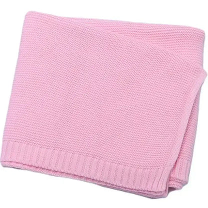 Soft pink 100% cotton knitted baby blanket, perfect for cozying up and personalizing with names for a unique gift.