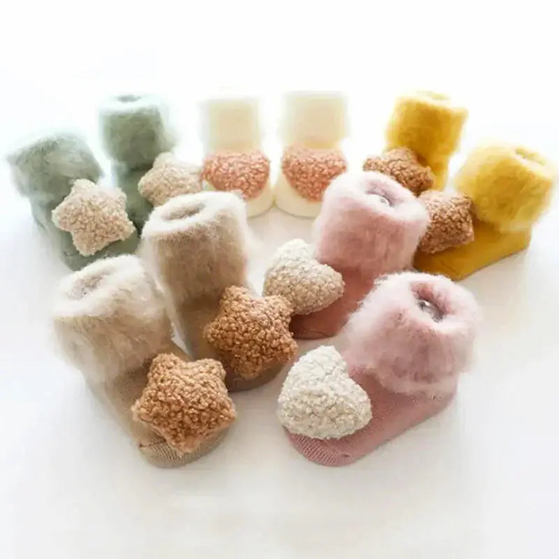 Puffy Fuzzy Snuggles Baby Socks in pastel colors featuring ultra-soft, anti-slip design for newborns and toddlers.