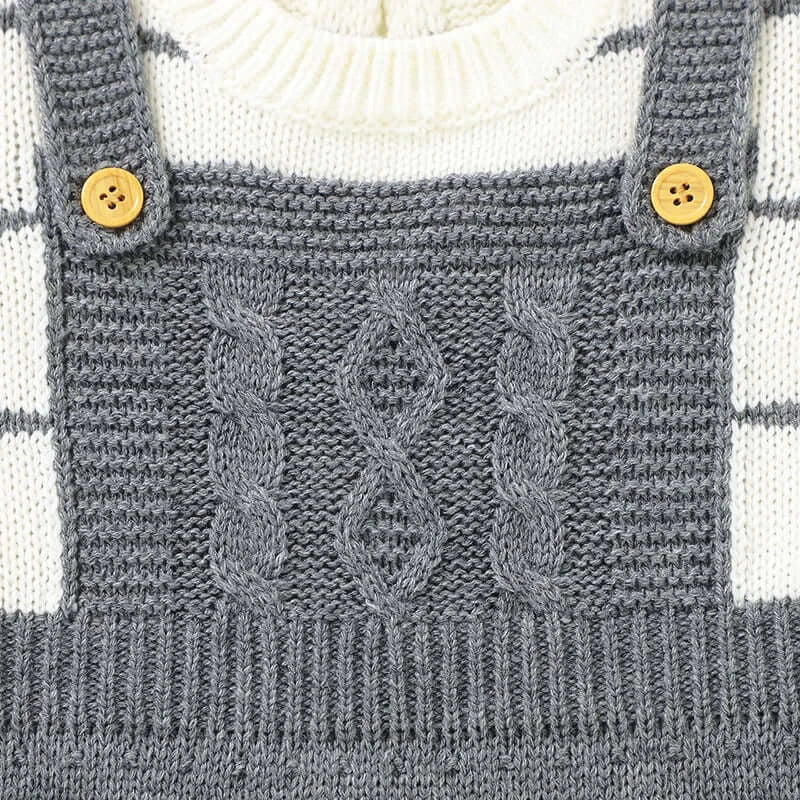 Baby knit suspender with cable pattern and button details in neutral tones, featuring Saratoga Stripes design.