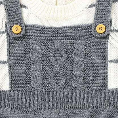 Baby knit suspender with cable pattern and button details in neutral tones, featuring Saratoga Stripes design.