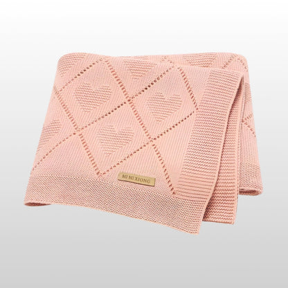 Super soft knit baby blanket in pink, ideal for newborns to toddlers, size 90x70cm.