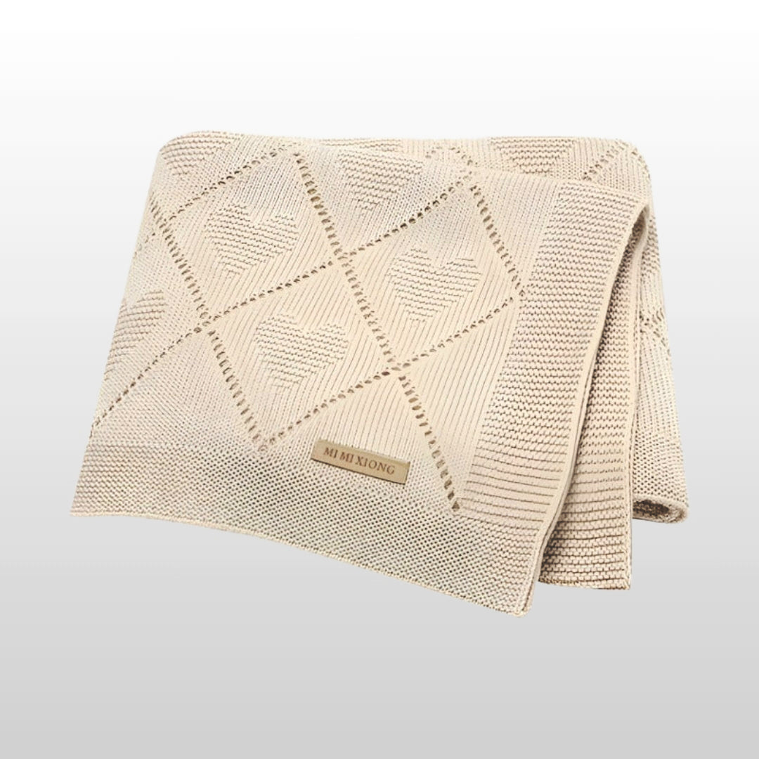 Super soft knit baby blanket, 90x70cm, beige color, cozy and stylish for newborns and toddlers.