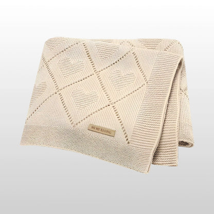 Super soft knit baby blanket, 90x70cm, beige color, cozy and stylish for newborns and toddlers.