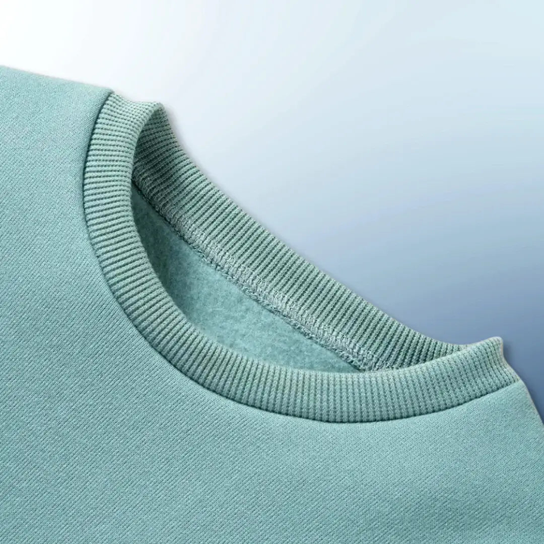 Close-up of mint green sweatshirt from Sweetheart Comfort Set showcasing soft, breathable fabric and ribbed neckline for cozy comfort.