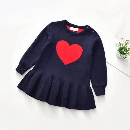 Sweetheart Knit Dress in navy with bold red heart design, long sleeves, perfect for little ones in fall or winter. Cozy and stylish!