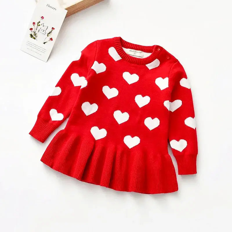 Sweetheart Knit Dress for kids, red with white heart design, cozy fall and winter wear, long-sleeve style, playful and warm.