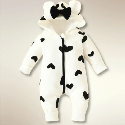 Heart print hooded onesie with bear ears for newborns, featuring a bow and cozy fabric. Perfect for snuggly baby fashion!