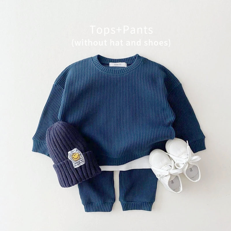 Trendy toddler navy mock undershirt sweatshirt and pants set, cozy waffle knit style for stylish playtime.