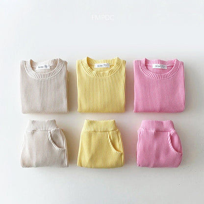 Trendy toddler cotton-waffle sweatshirt and pants set in beige, yellow, and pink, perfect for stylish comfort.