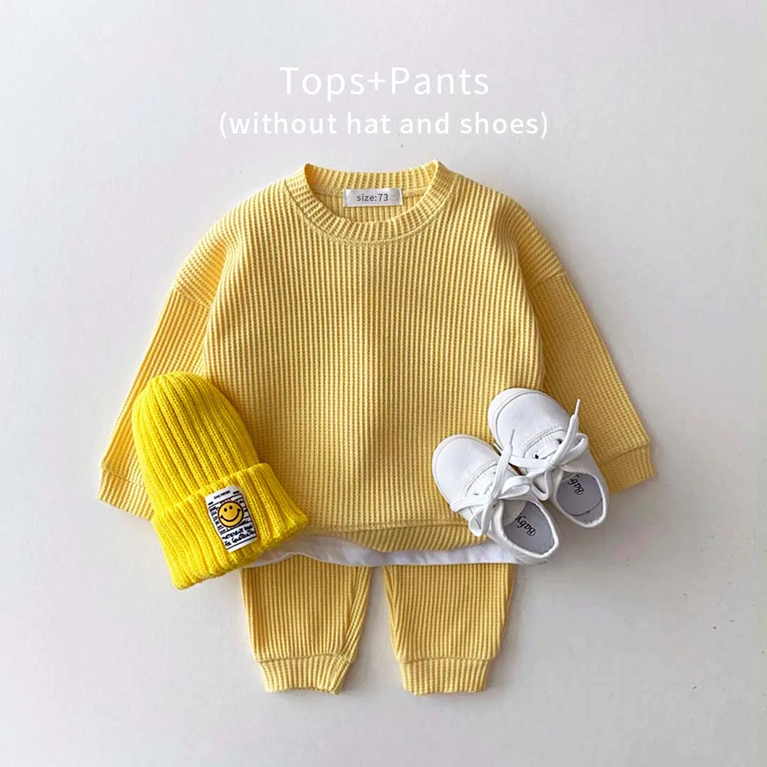 Trendy yellow cotton-waffle toddler sweatshirt and pants set ideal for chic, cozy outfits without hat and shoes.