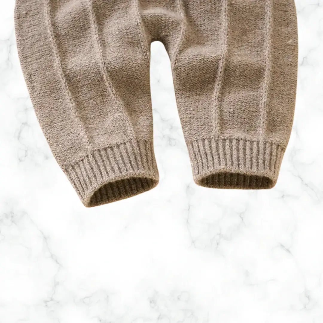 Cozy Verona Stroll Knit Baby Pants in warm brown, perfect for autumn adventures. Soft knit fabric for comfort and style.