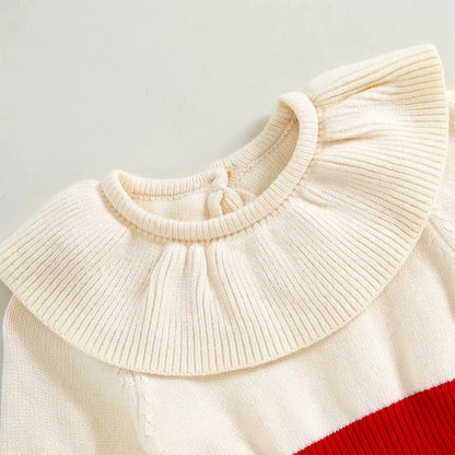 Ivory knit romper for babies with ruffled collar, perfect for festive fall and winter events. Vibrant, cozy, and stylish baby outfit.